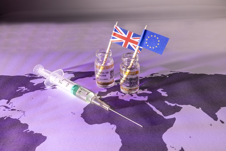 syringe with EU and UK flags