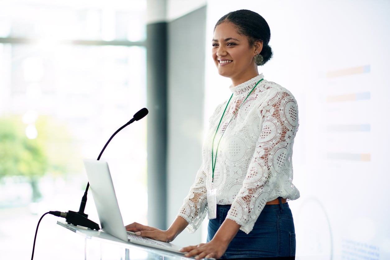 Shot of a young businesswoman delivering a presentation at a conference